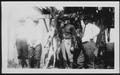 Photograph: [Albert Peyton George and three other men posed with trussed deer]