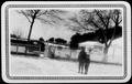 Photograph: [Albert Peyton George and Mary Jones in the snow covered ranch yard]