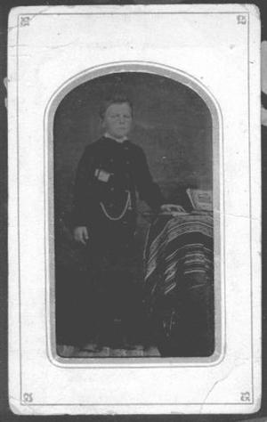 [Albert Peyton George as a boy, wearing a dark military style outfit]