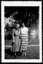 Primary view of [Photograph of Mamie Davis George (left) standing next to an unidentified woman]