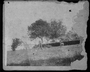 Primary view of [Photograph of Davis George drinking water in the front yard]