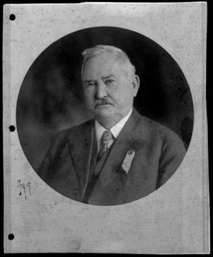 [J.H.P. Davis with a dark suit and a spotted tie]