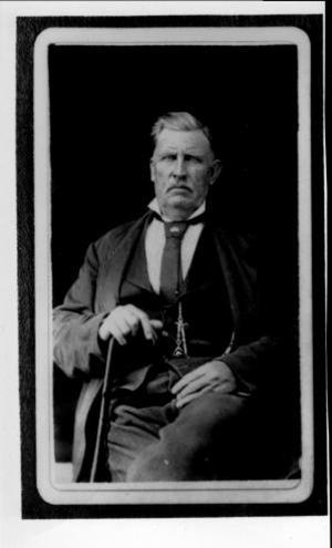 [William Kinchen Davis seated, with his right hand on a cane]