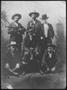Primary view of [Photograph of six men with a dog]