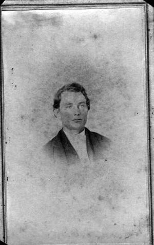 [Bust photograph of a young man wearing a dark jacket]