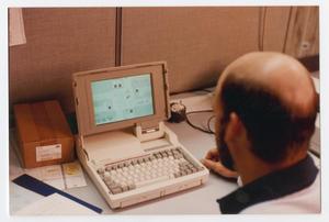 [Man using a closed-loop computer system]
