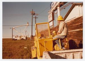 Primary view of object titled '[City of Denton utility workers at power lines]'.