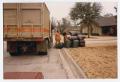 Photograph: [Solid Waste Department employees picking up trash]