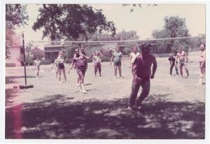 [City of Denton employees playing volleyball in the park]