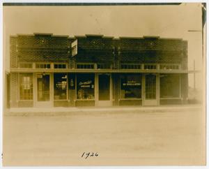 Primary view of object titled '[Photograph of Desmond's Grocery Storefront]'.