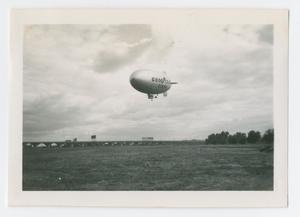 [Photograph of Goodyear Tires Blimp in the Air]