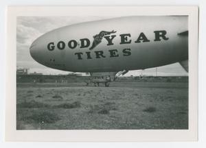 Primary view of object titled '[Photograph of Goodyear Tires Blimp at Trinity River]'.