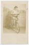 Thumbnail image of item number 1 in: '[Photograph of Man Standing Against Backdrop with Bicycle]'.