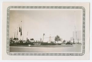 Primary view of object titled '[Photograph of Texas Hall of State and Flags]'.