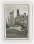 Photograph: [Photograph of Clock Tower and Street in Dallas]