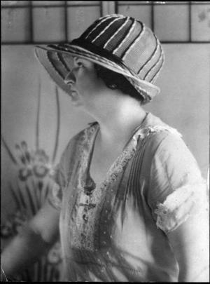 [Aline Dewalt Martin wearing a hat and looking to the side]