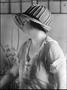 Photograph: [Aline Dewalt Martin wearing a hat and looking to the side]