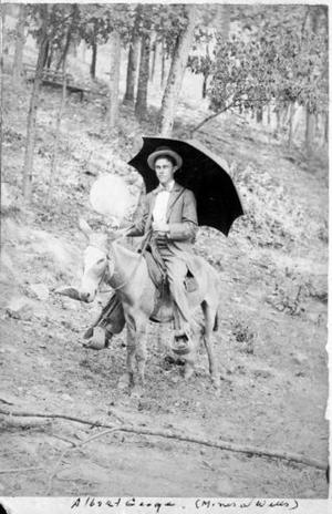 [A.P. George as a young man, riding a saddled mule]