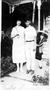 Photograph: ["Ruth & Len" standing on a walkway]