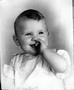 Photograph: ["Jimmy Booth" an infant, wearing a white top with ruffled sleeves]