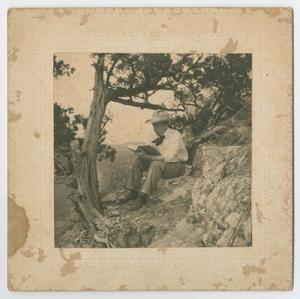Primary view of object titled '[Man Reading on Mount Bonnell]'.
