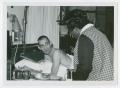 Thumbnail image of item number 1 in: '[Barbara Jordan with a Patient of the Houston Veterans Administration Hospital]'.
