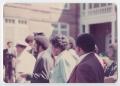 Photograph: [A Group of People Walk Into the Tuskegee Institute]