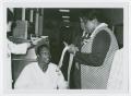 Thumbnail image of item number 1 in: '[Barbara Jordan Signs an Autograph of a Patient of Houston Veterans Administration Hospital]'.