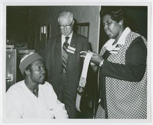 [Barbara Jordan Signs an Autograph of a Patient of Houston Veterans Administration Hospital]