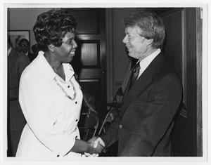 [Barbara Jordan and President Jimmy Carter Shake Hands]