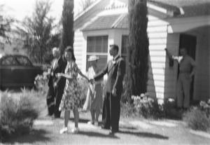Primary view of object titled '[Five People Outside a House]'.
