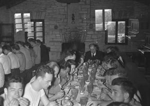 [People Eating at the Austin Seminary picnic at the Zilker Park Clubhouse]