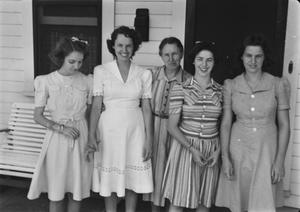 [Women Posing for a Picture Outside a House]