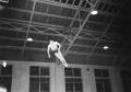 Photograph: [Man in Midair Doing Gymnastics]