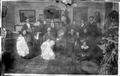 Photograph: [A large family inside of a house]