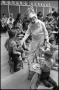 Photograph: [Woman Dressed as Easter Bunny Greeting Children Eating]