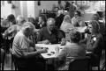 Photograph: [Elderly Citizens at Various Tables Playing Dominoes]