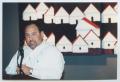 Photograph: [Photograph of Zee Zepeda Speaking at the Podium]