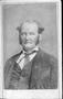 Photograph: [An unidentified man with gray wiry sideburns]