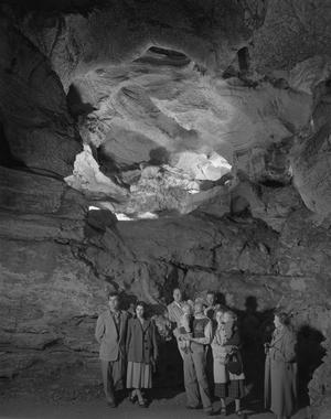 Primary view of [Portrait of People Standing Inside a Cave]