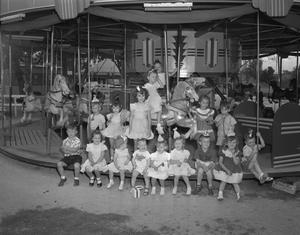 [Group of Children on a Carousel]