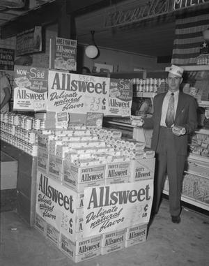 Primary view of object titled '[Man Posing With an Allsweet Display]'.
