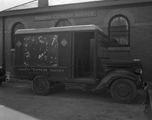 [Railway Express Agency Truck Parked Outside a Building]