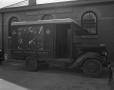 Primary view of [Railway Express Agency Truck Parked Outside a Building]