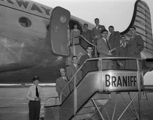 [Group of Men Boarding an Airplane]