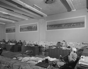 [Men Working in a Room at an American National Bank Building]