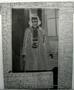 Primary view of [Negative film of Mary Jones Prowell standing in front of a window]