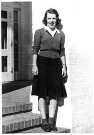 [Mary Jones on the front steps of the Pi Beta Phi Sorority House]