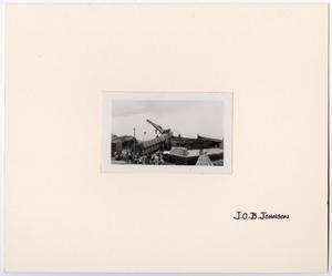 Primary view of object titled '[Wrecked Train Cars by a Crane]'.