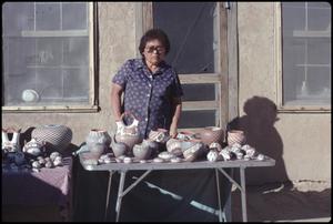 Primary view of object titled '[Potter at Acoma Pueblo]'.